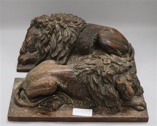 A pair of oak carvings of lions height 15cm width 37cm